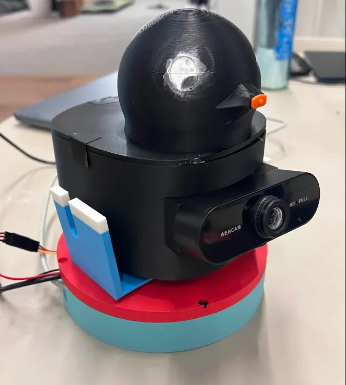 The black DOD duck mounted on its colourful rotating water-turret base